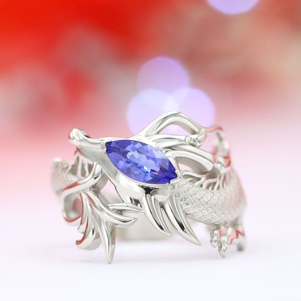 This white gold ring brings the dragon theme to life with a violet-blue tanzanite placed atop the beast’s head.