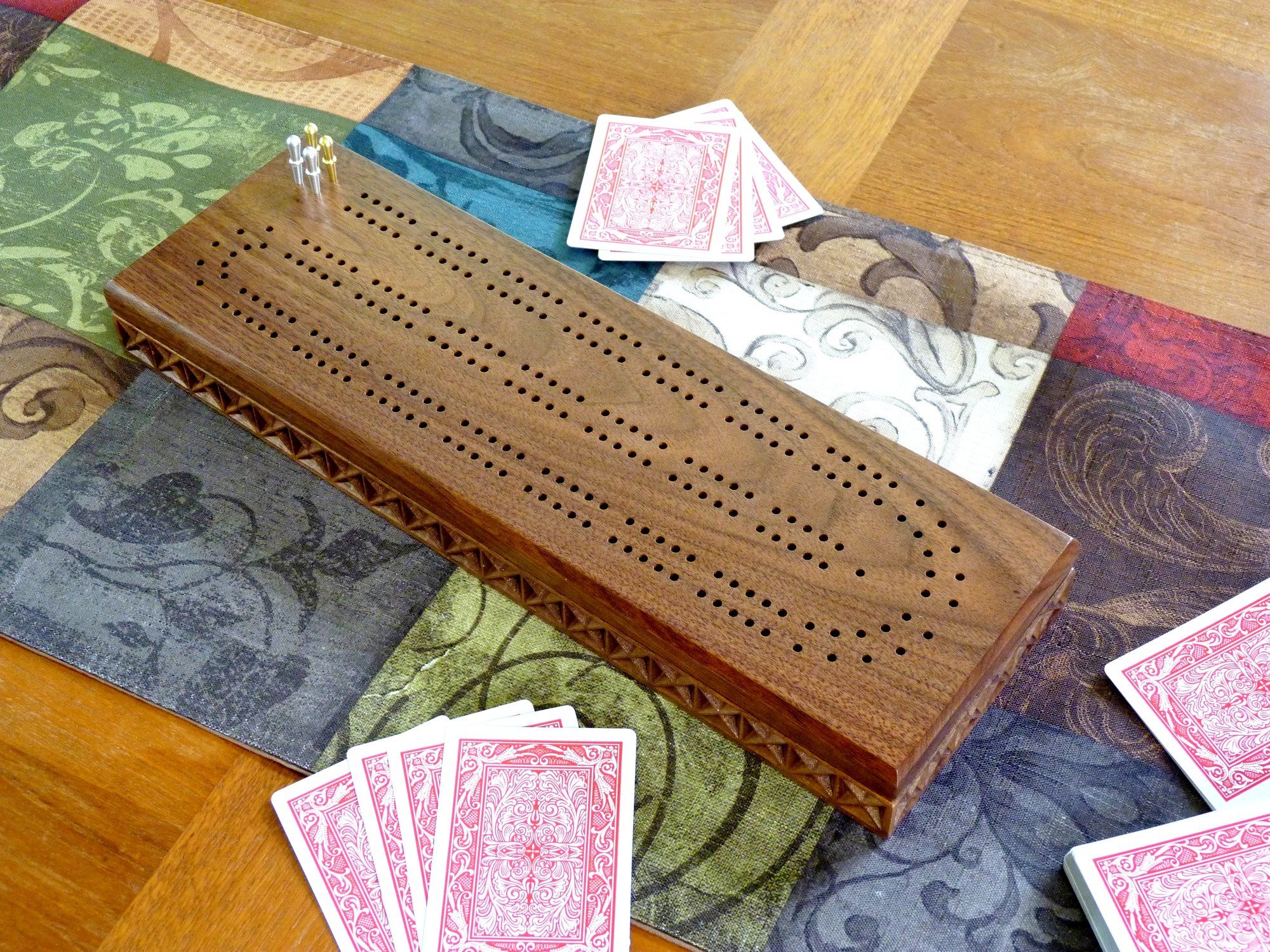 hand-made-carved-cribbage-board-in-walnut-or-cherry-wood-by-three-trees