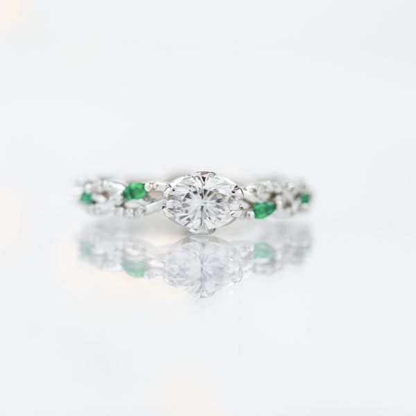 We’re getting green goddess vibes from this nature inspired east-west engagement ring.