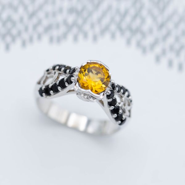 A beautifully high-contrast pairing of yellow citrine and black onyx with a butterfly shank.