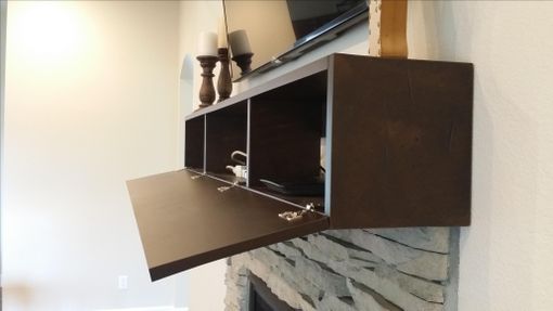 Custom Made Fireplace Mantel With Hidden Storage