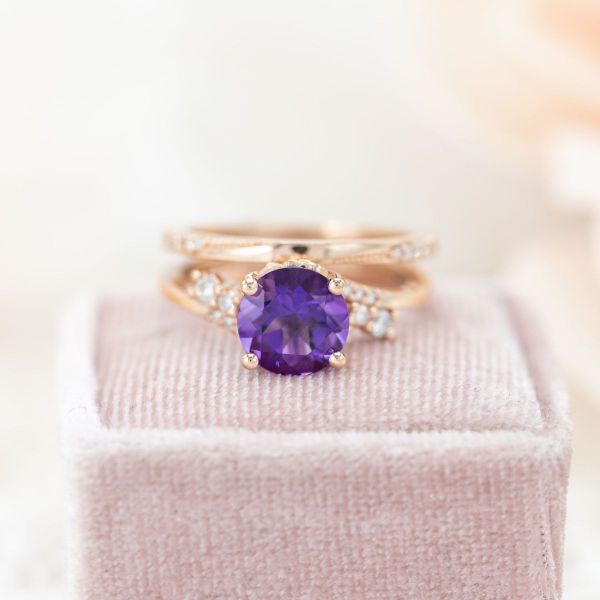 This amethyst engagement ring is set in rose gold.