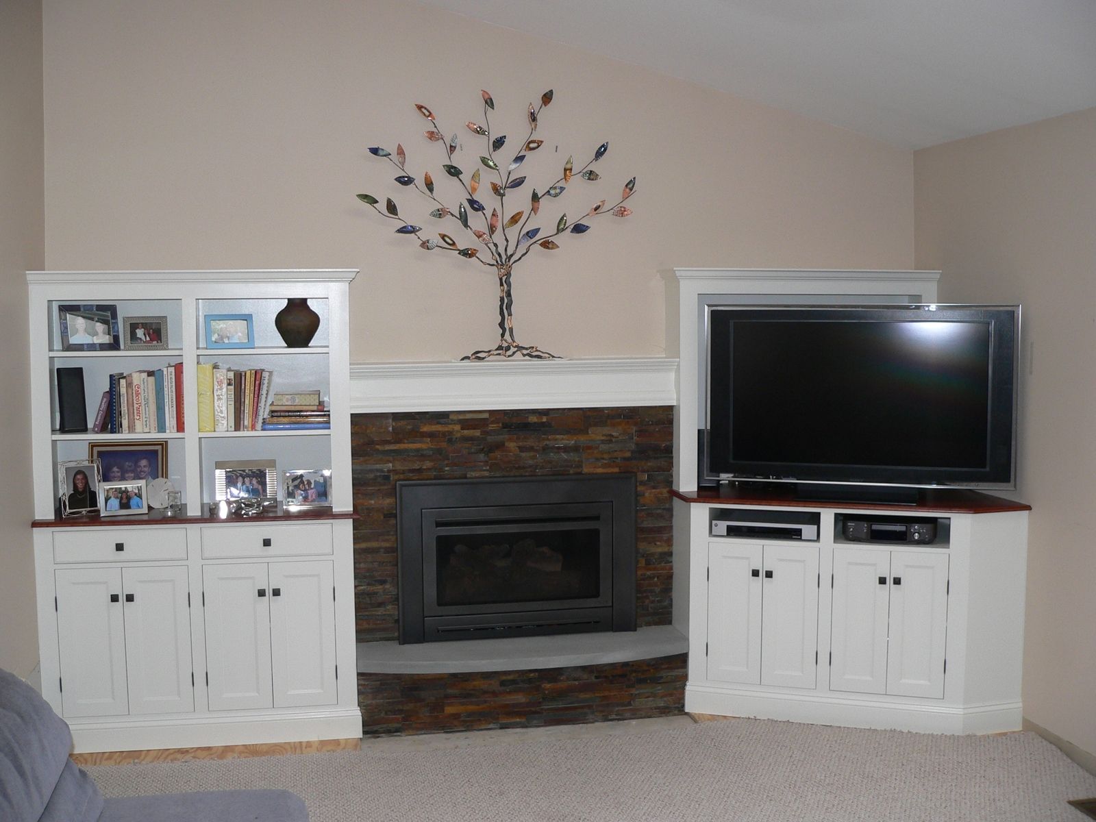 This Long Wall Of Shelving Incorporates Storage, A Fireplace