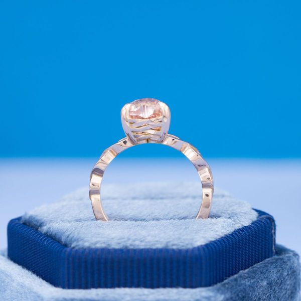 This engagement ring’s heart cut morganite matches the rose gold band with a hidden shoelace peekaboo in the gallery.