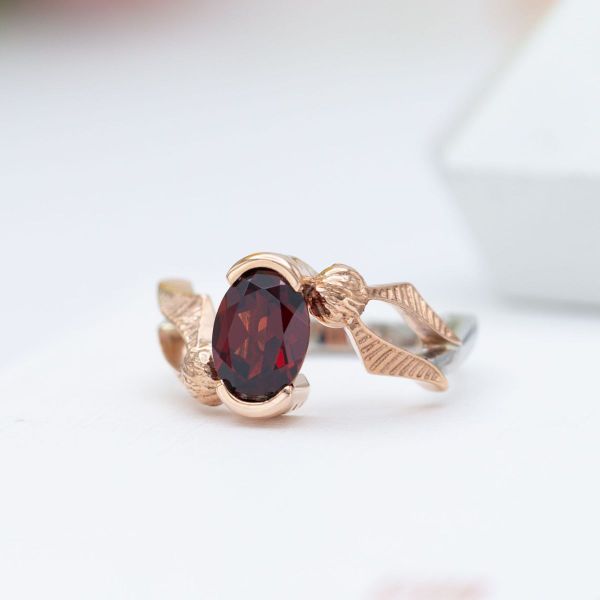 The stunning Mozambique garnet is magically set with rose and white gold.