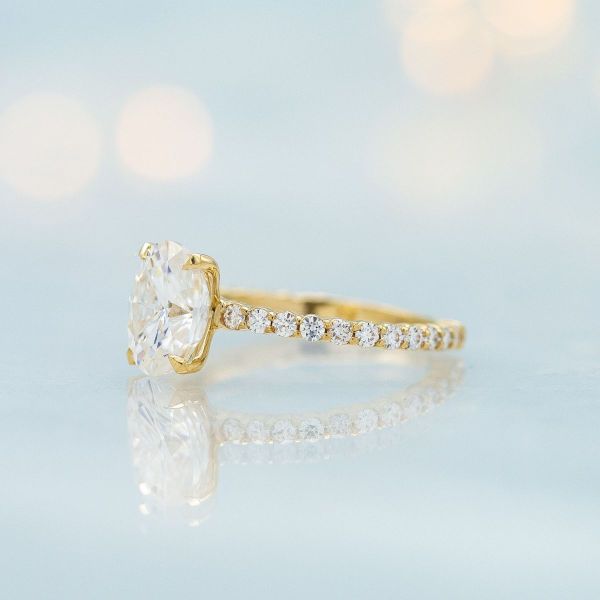 A timeless take on an oval cut moissanite with pave setting.