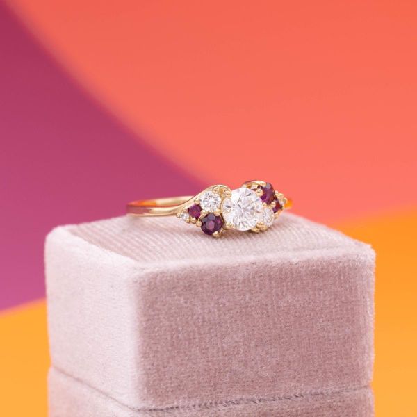 For this yellow gold ring, rubies and diamonds create a colorful center.
