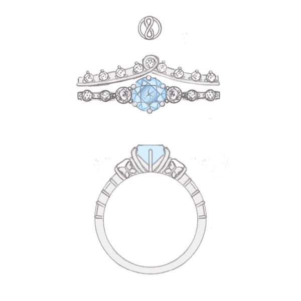 Peekaboo butterflies are hidden beneath the accent stones of this aquamarine and diamond engagement ring.