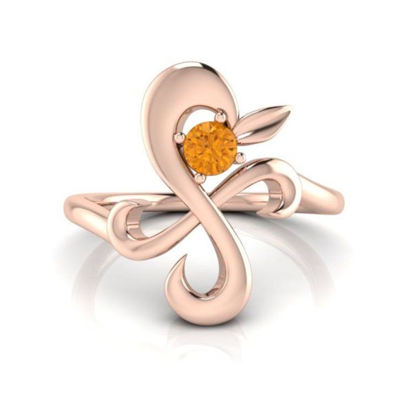A giant pinwheel in rose gold with a sunny citrine resembles Nami’s tattoo in this One Piece inspired engagement ring.