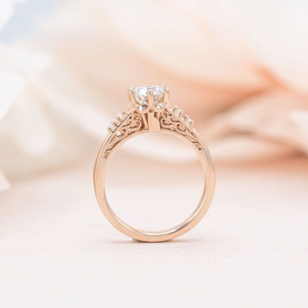 This diamond and opal ring is an elegant example of cat inspired design.