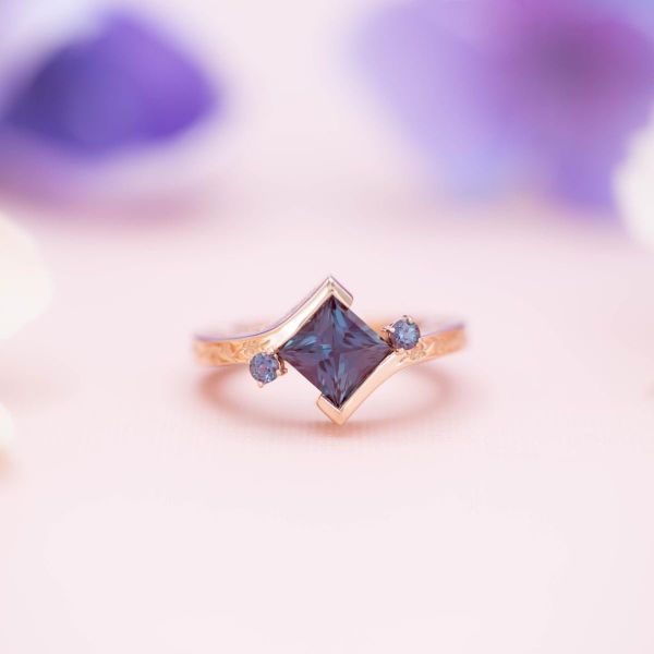 Kite-set princess cut alexandrite in a modern, rose gold engagement ring design.