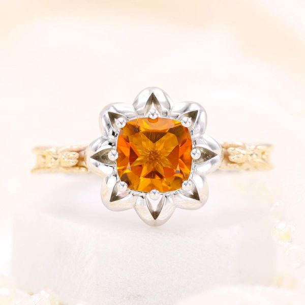 A cushion cut citrine is turned into a beautiful bloom in this nature-inspired engagement ring.