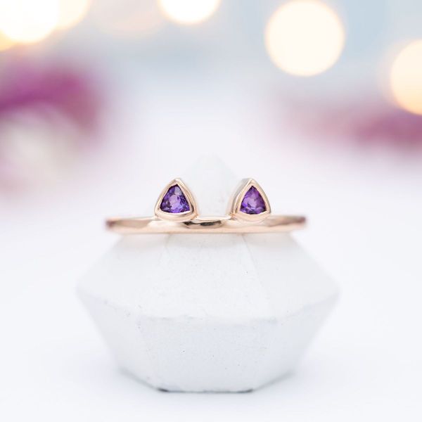 Two trillion but amethysts make perfect cat ears in this engagement ring.