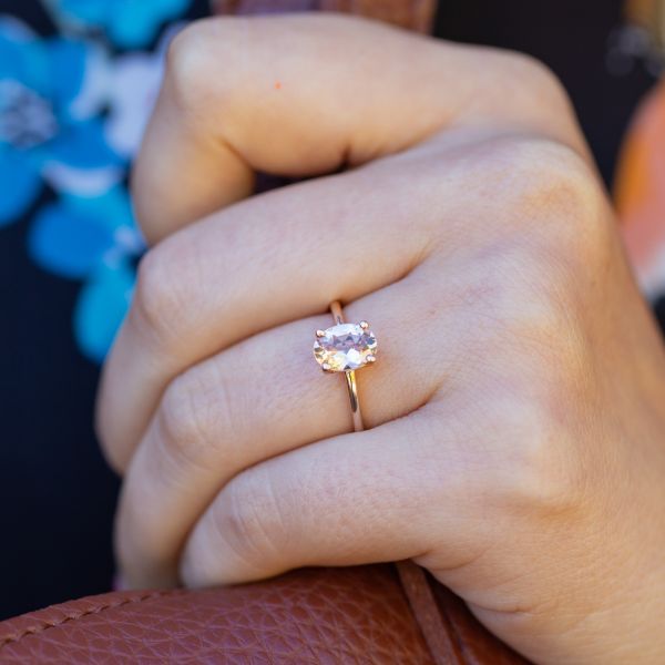 The perfect contemporary solitaire: a bright, champagne pink morganite in a delicate rose gold setting.