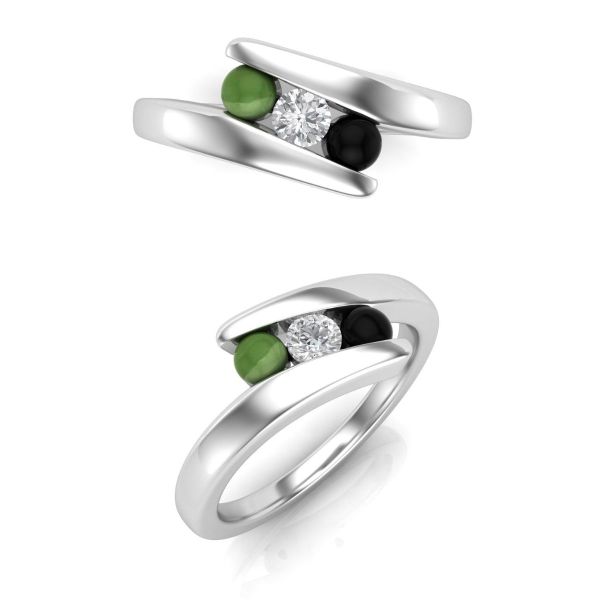 This engagement ring’s round diamond sparkles next to round jade and black onyx gemstones that sit between a faux tension white gold band.