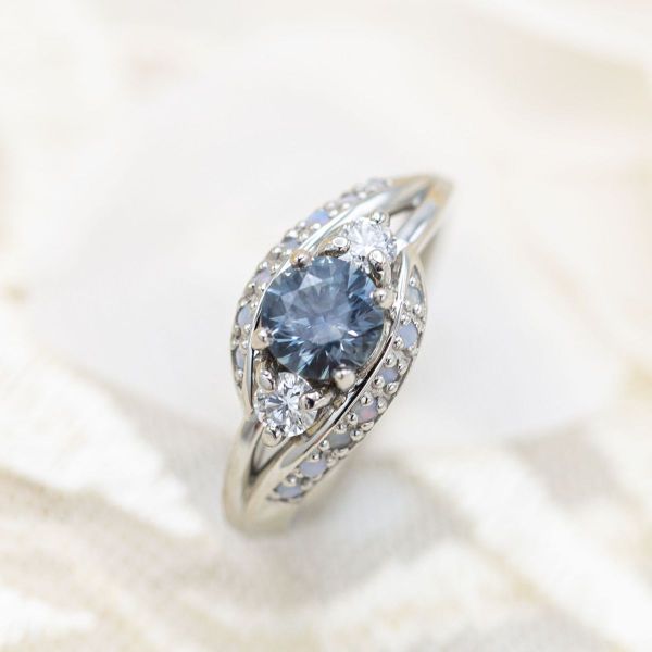 This blue sapphire has a light saturation that gives it an almost steely look.