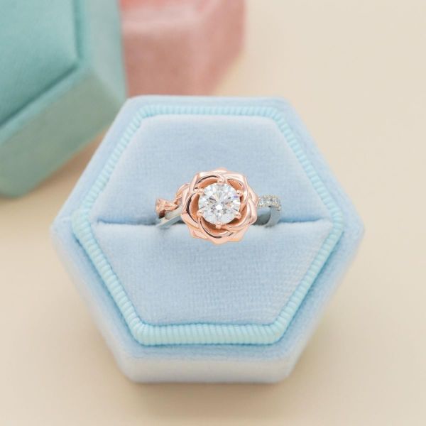 A lab diamond sits in the center of a setting designed to emulate a rose opening.