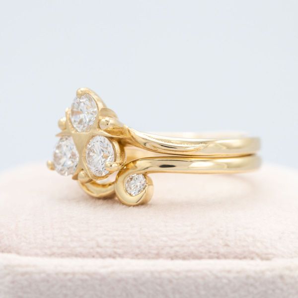 This elegant Zelda inspired engagement ring features yellow gold and diamond accents in the shape of Zora’s Sapphire.