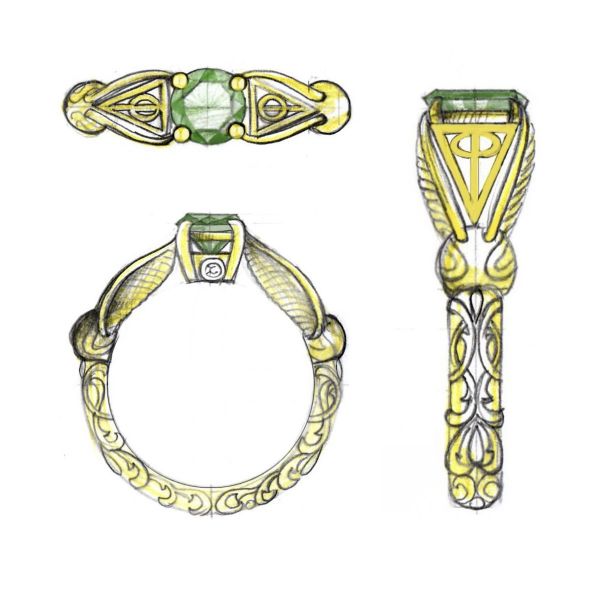 A brilliant round-cut emerald sits between two deathly hallows inspired symbols, between the wings of two familiar gold winged balls.