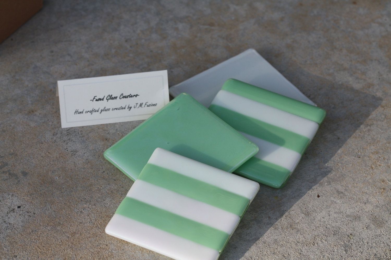 Hand Made White And Sea Green Glass Coasters In Set Of 4 by J.M