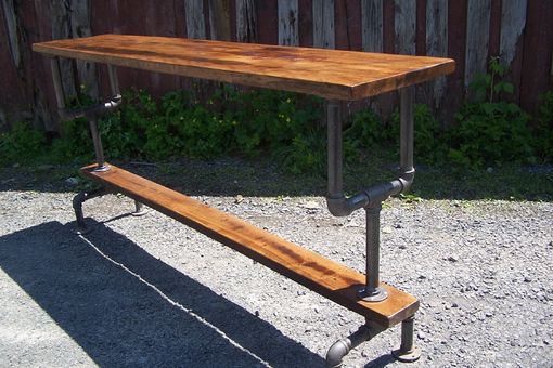 Custom Made Industrial Styled Bar Height Table With A Metal Pipe Base And Salvaged Wood Planks Top