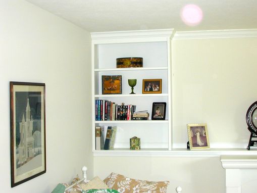 Custom Made Built-In Shelving With Crown Molding Trim