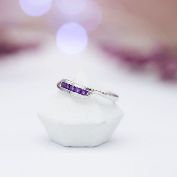 Practicality doesn’t mean boring, as proven by this striking white gold and channel-set amethyst ring.