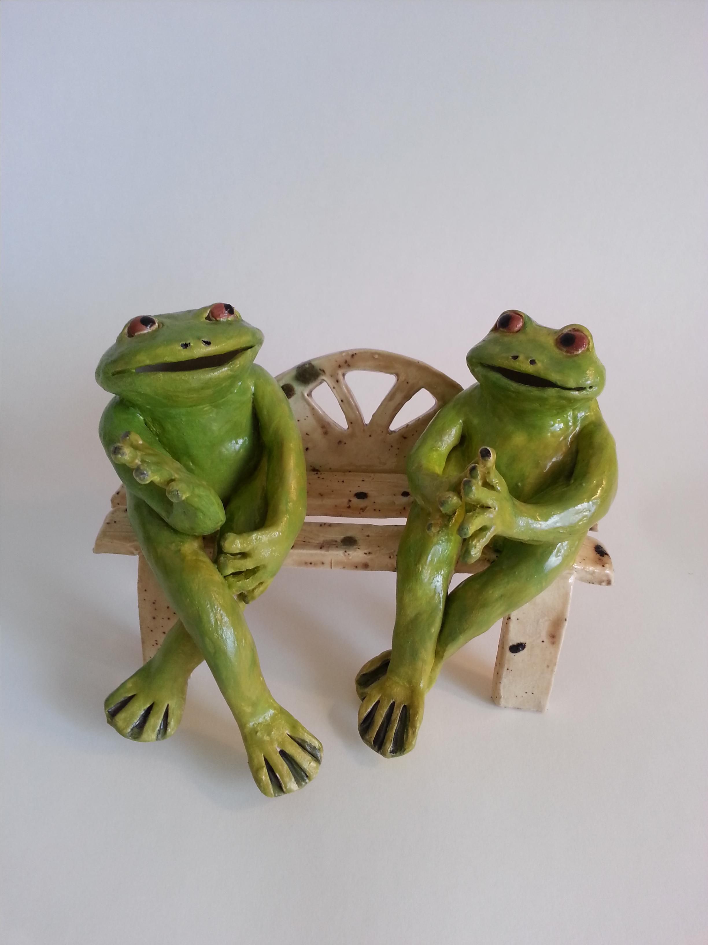 frogs on a bench garden statue