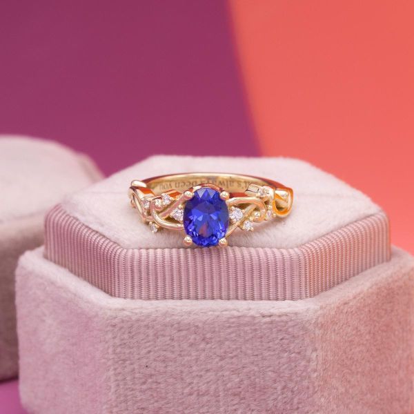Tanzanite has an electric bluish-purple as the center of this engagement ring.