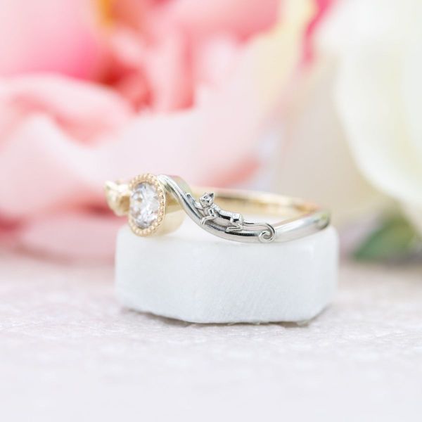 Yellow and white gold come together in this cat engagement ring.