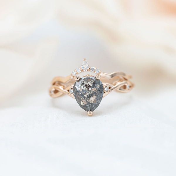 This salt and pepper diamond has more of a black background with light inclusions.