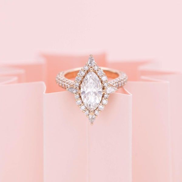A marquise lab diamond looks extra sparkly when surrounded by a diamond halo and pavé band.