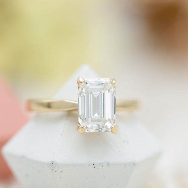 An elegant 2.52ct emerald cut diamond set in a clean, modern setting.