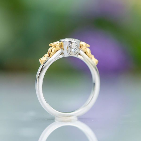  Inspired by Pikachu, this diamond white gold ring sports two of the little critters in yellow gold crawling up the band.