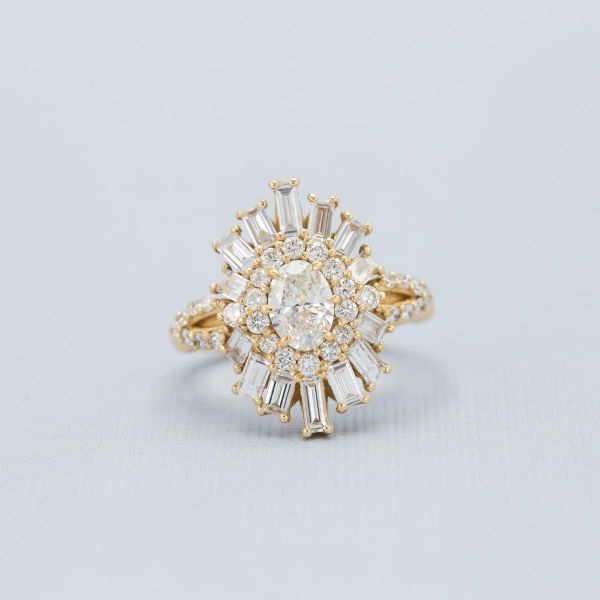 This glittering sunburst halo engagement ring is made of various shapes of lab diamond.