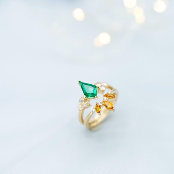Kite cut emerald, marquise citrines, and opals combine in this vibrant bridal set.