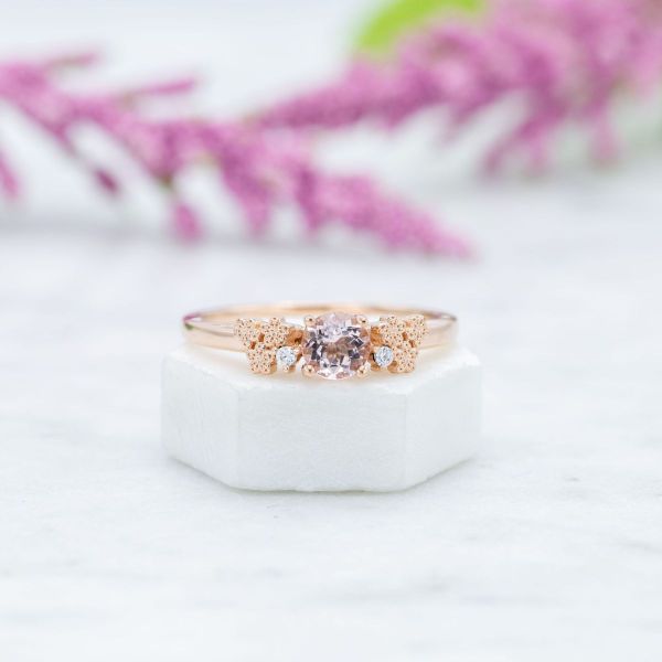 A smaller carat of morganite makes the stone appear lighter and less saturated in color.