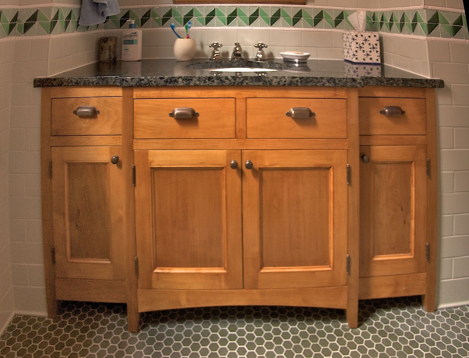 bathroom with maple cabinets