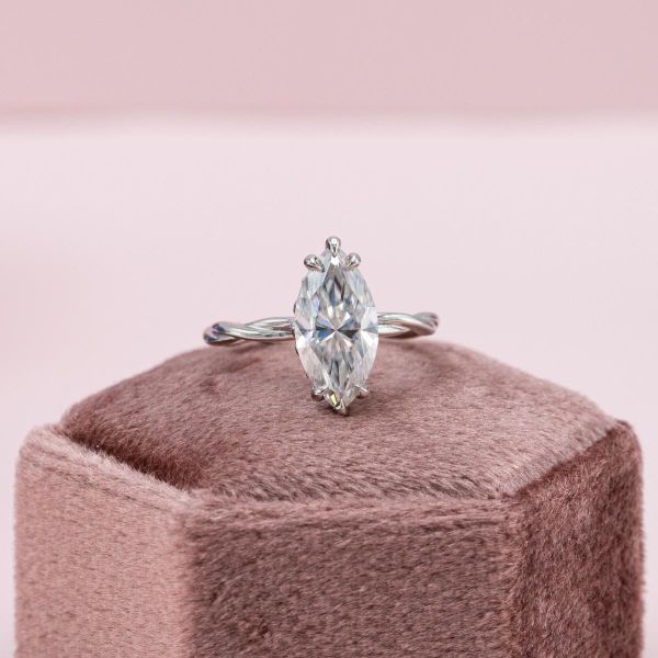 A simple marquise solitaire moissanite engagement ring.
