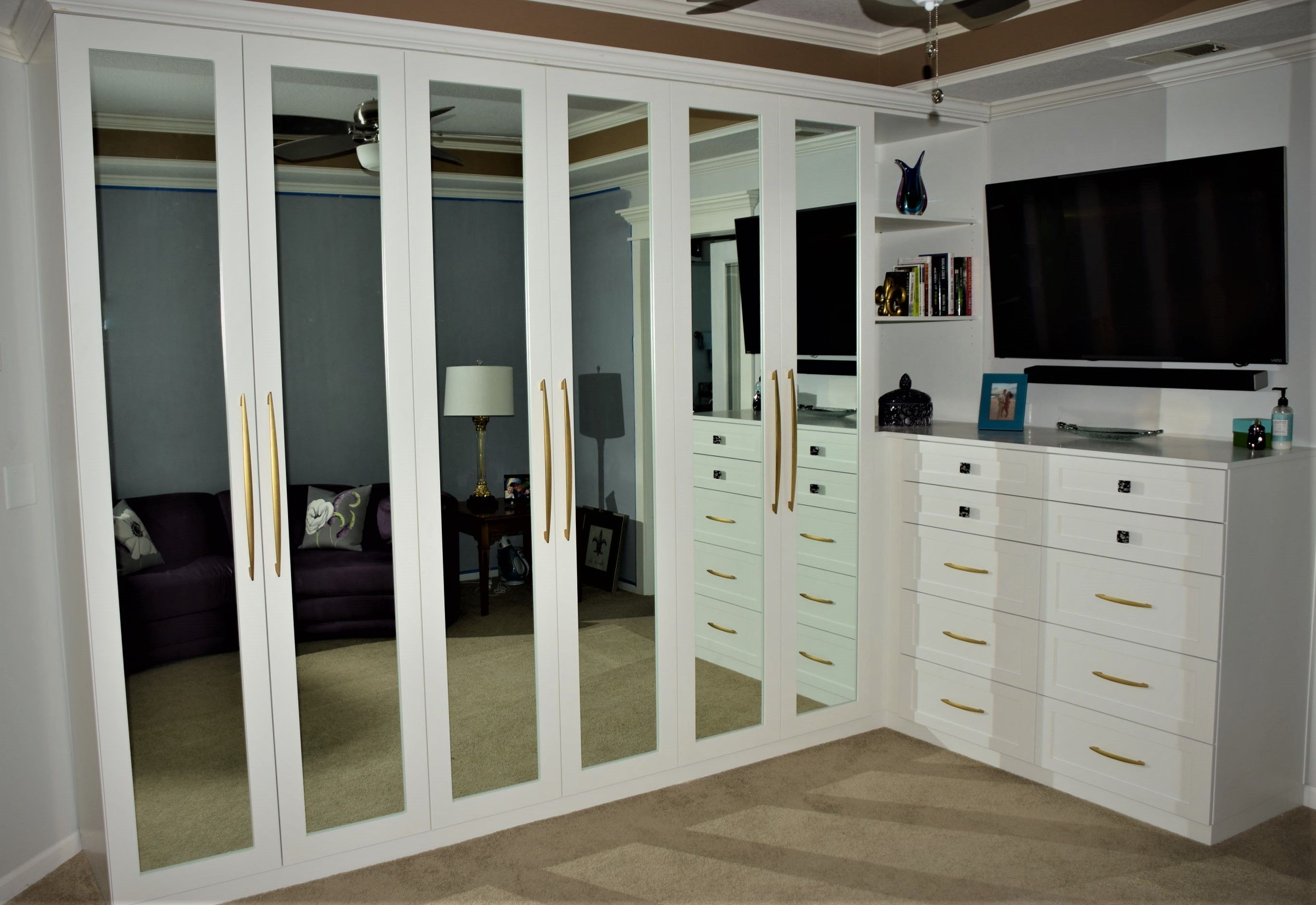 Custom White BuiltIn Closet Unit by Belak Woodworking LLC
