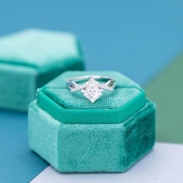 Angles are the main design point of this kite shaped moissanite engagement ring.