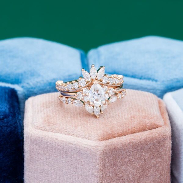 No boring shapes here as pear, marquise, and round moissanites make up this blinged out bridal set.