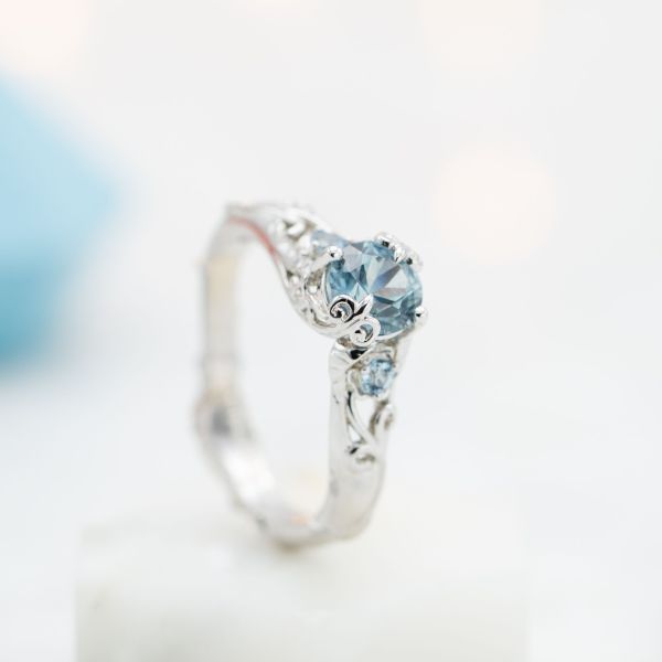 This customer was looking for a sky blue sapphire. The perfect drop of bright blue for the natural, curvy engagement ring we designed together.