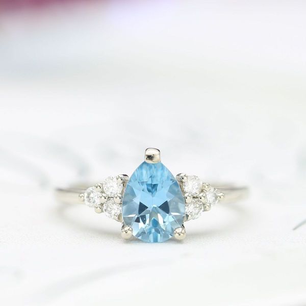 This pear aquamarine is a medium/dark saturation showing the crisp blue of the stone.