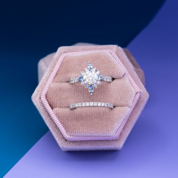 Marquise cut aquamarines make beautiful sunburst accent stones in this diamond ring.