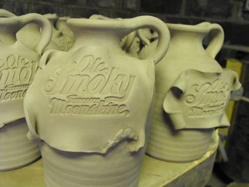 Custom Made Logo Xxx Jugs And Mugs For Ole Smoky Moonshine Distillery.