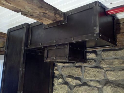 Custom Made Steel Plates On A Timber Wall.