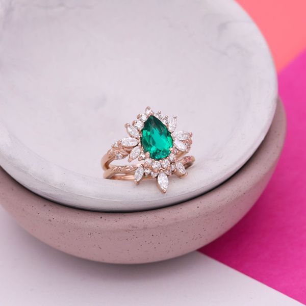 This pear shaped emerald has blue undertones.