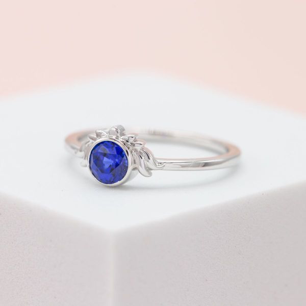 A lab-created sapphire is elegantly set in white gold.