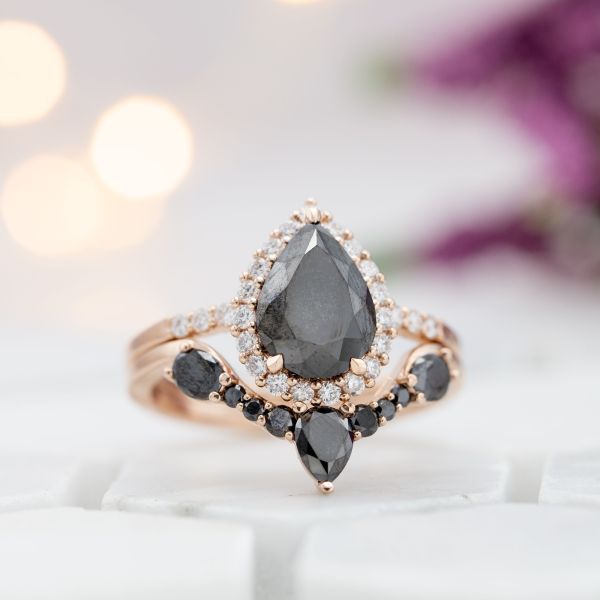 A rose gold bridal set with a striking combination of black and white diamonds.